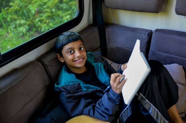 Danny journaling in the Campervan